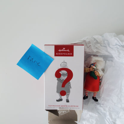 2023 Hallmark Toymaker Santa Surprise Rare Red Paint Ornament