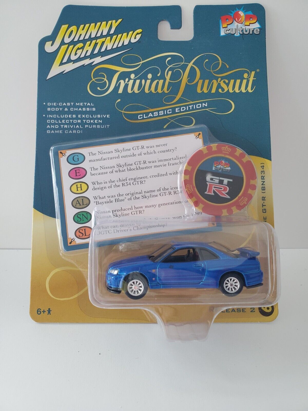 2022 Johnny Lightning Trivial Pursuit 1999 Nissan Skyline GT-R (BNR34)