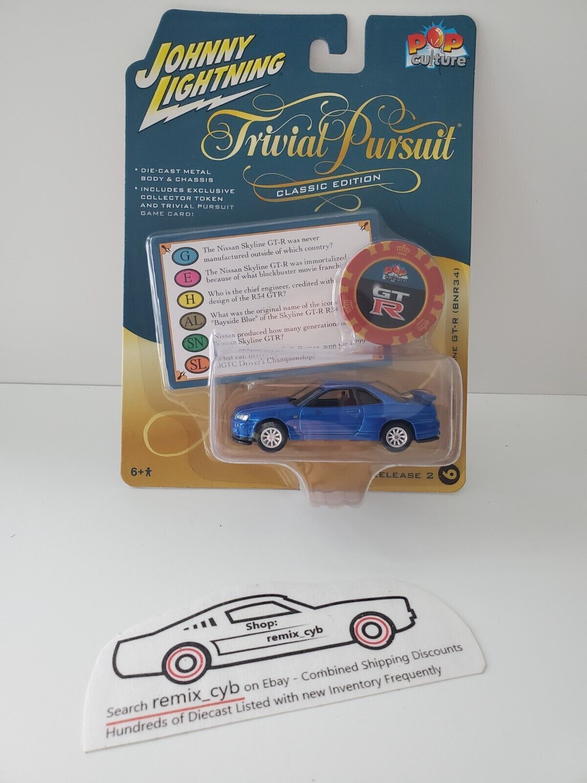 2022 Johnny Lightning Trivial Pursuit 1999 Nissan Skyline GT-R (BNR34)