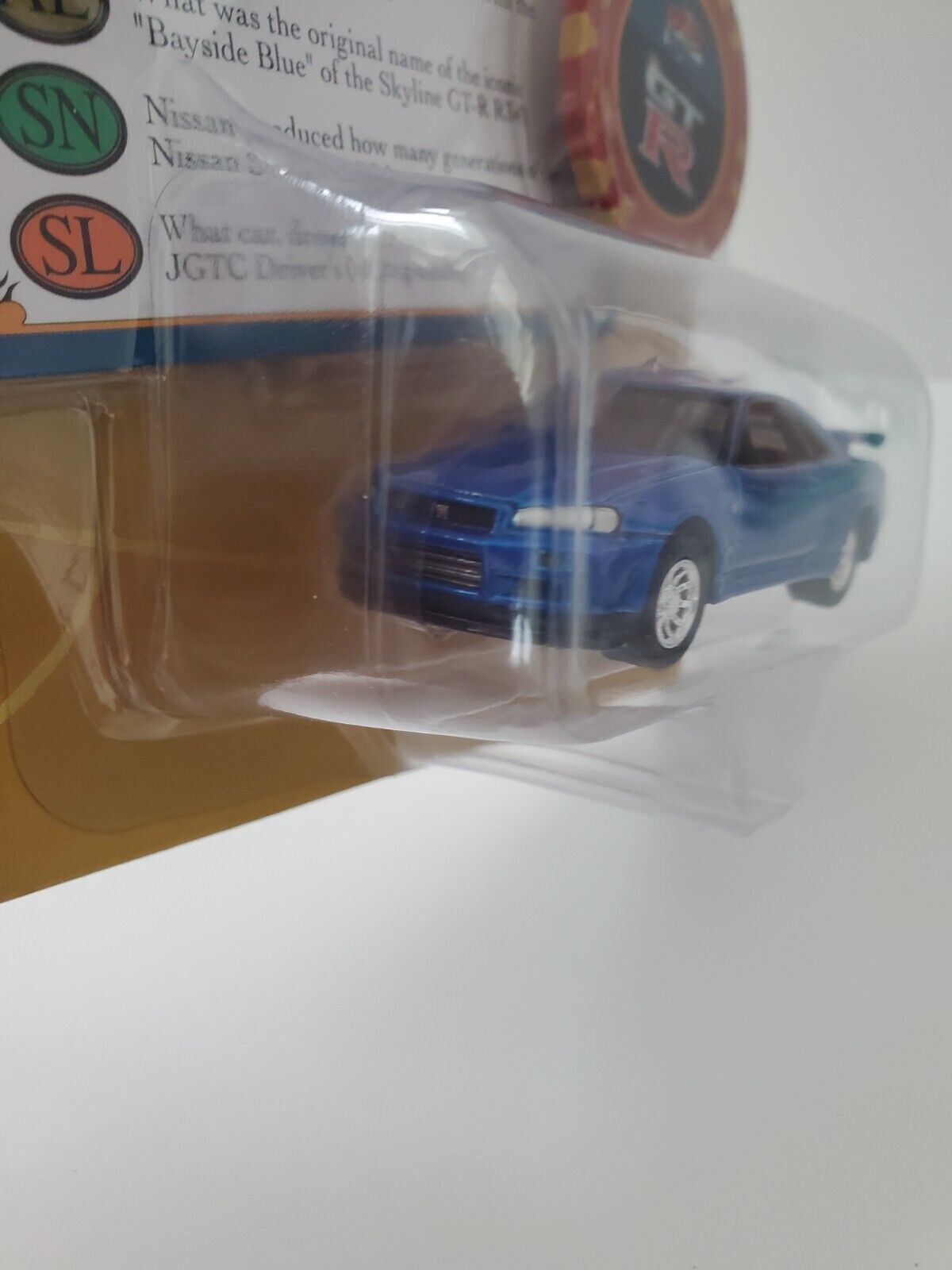 2022 Johnny Lightning Trivial Pursuit 1999 Nissan Skyline GT-R (BNR34)